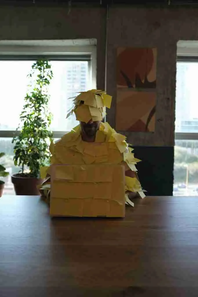 Financial stress is killing me. A person covered in post-it notes. 