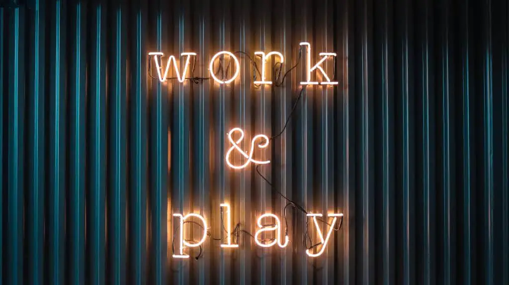sign saying work and play
how to build wealth in your 40s